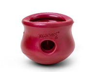 Thumbnail for West Paw Toppl in red, a durable, interactive dog toy with a hollow center for treats and a rounded base.