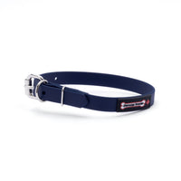 Thumbnail for Navy biothane dog collar with a silver metal buckle and a black Smoochy Poochy label.