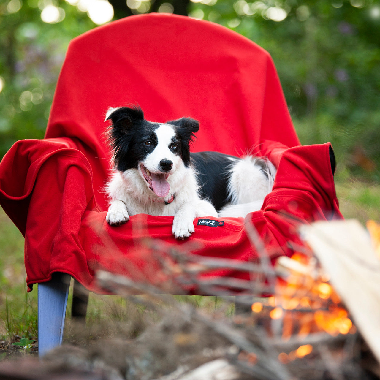 Alpine Blanket being used to keep warm camping