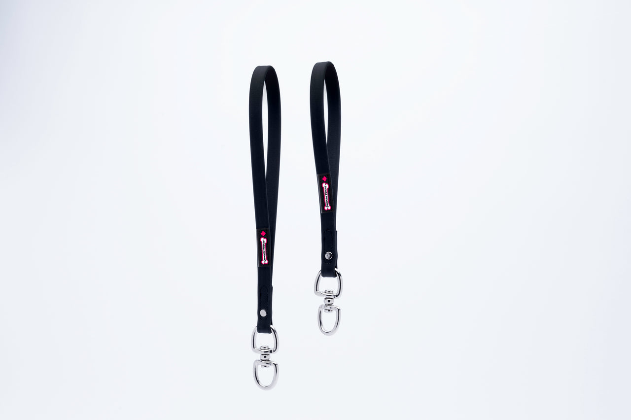 Two black Biothane Smoochy Poochy handles with metal swivel clips on a white background.