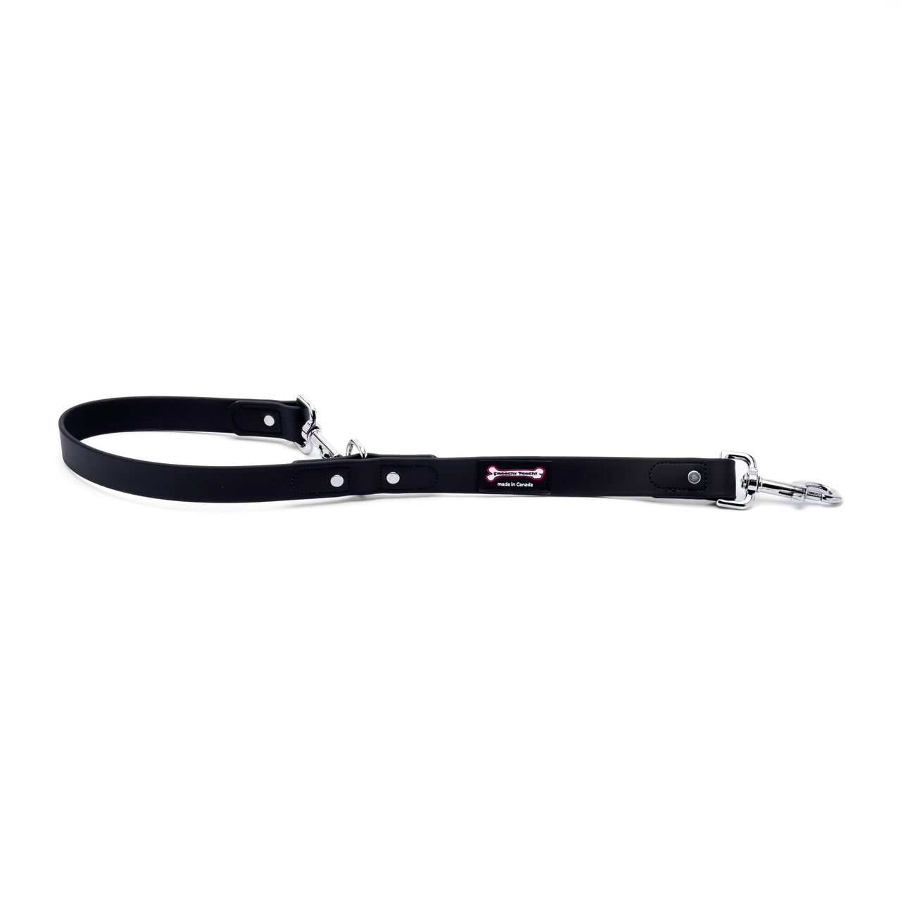 Black Biothane dog leash with two metal clasps and adjustable rivet loop