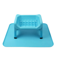 Thumbnail for Fluff Trough silicone mat in light blue with a raised feeding trough and textured surface for stability.