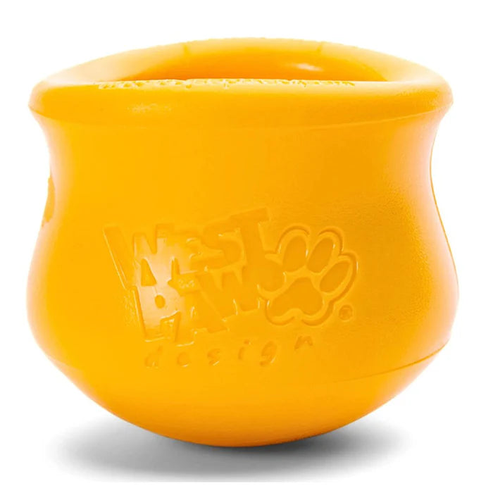 West Paw Toppl in bright yellow, featuring a paw print logo, designed for interactive pet play and treat dispensing.